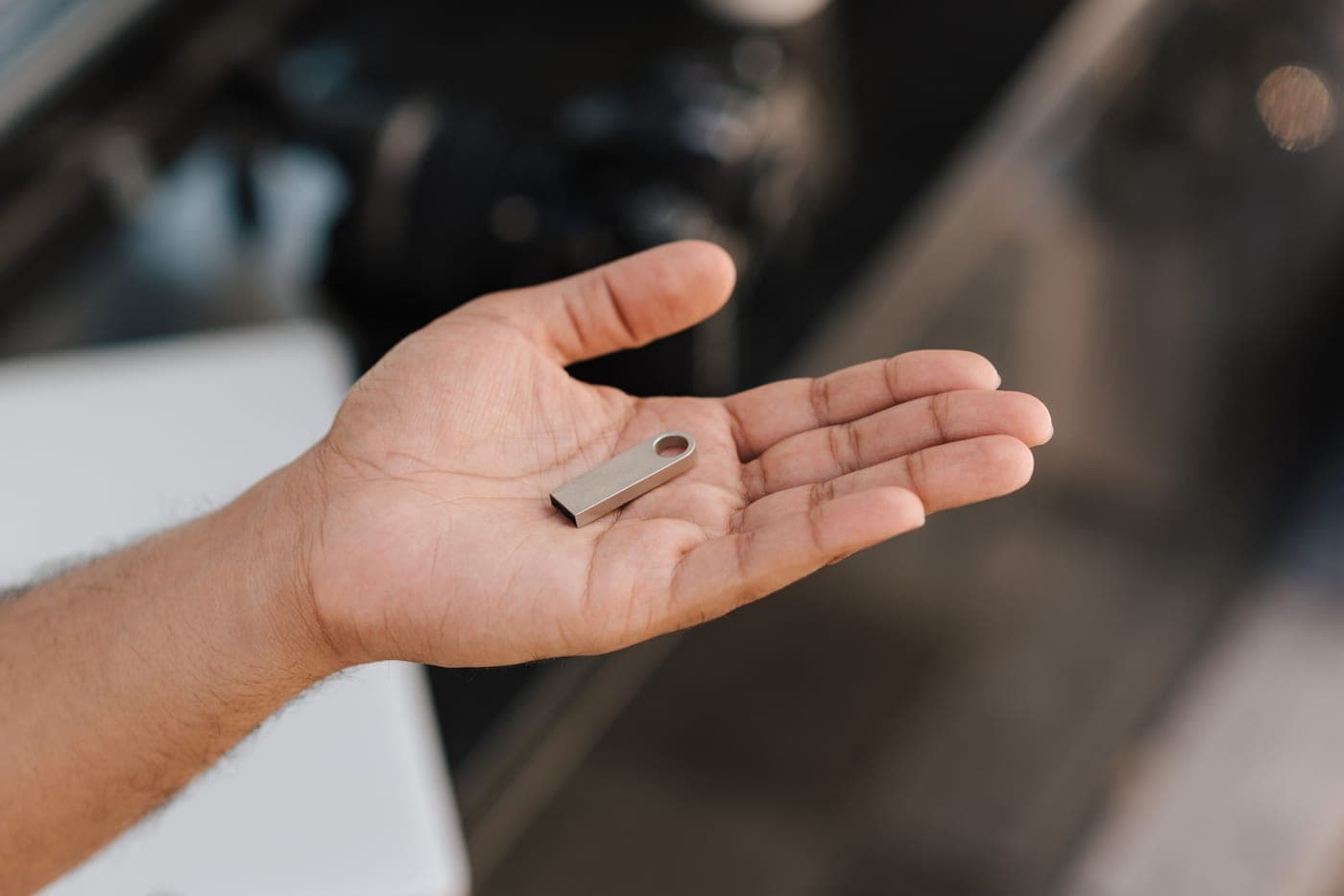A small gadget resting in an open palm