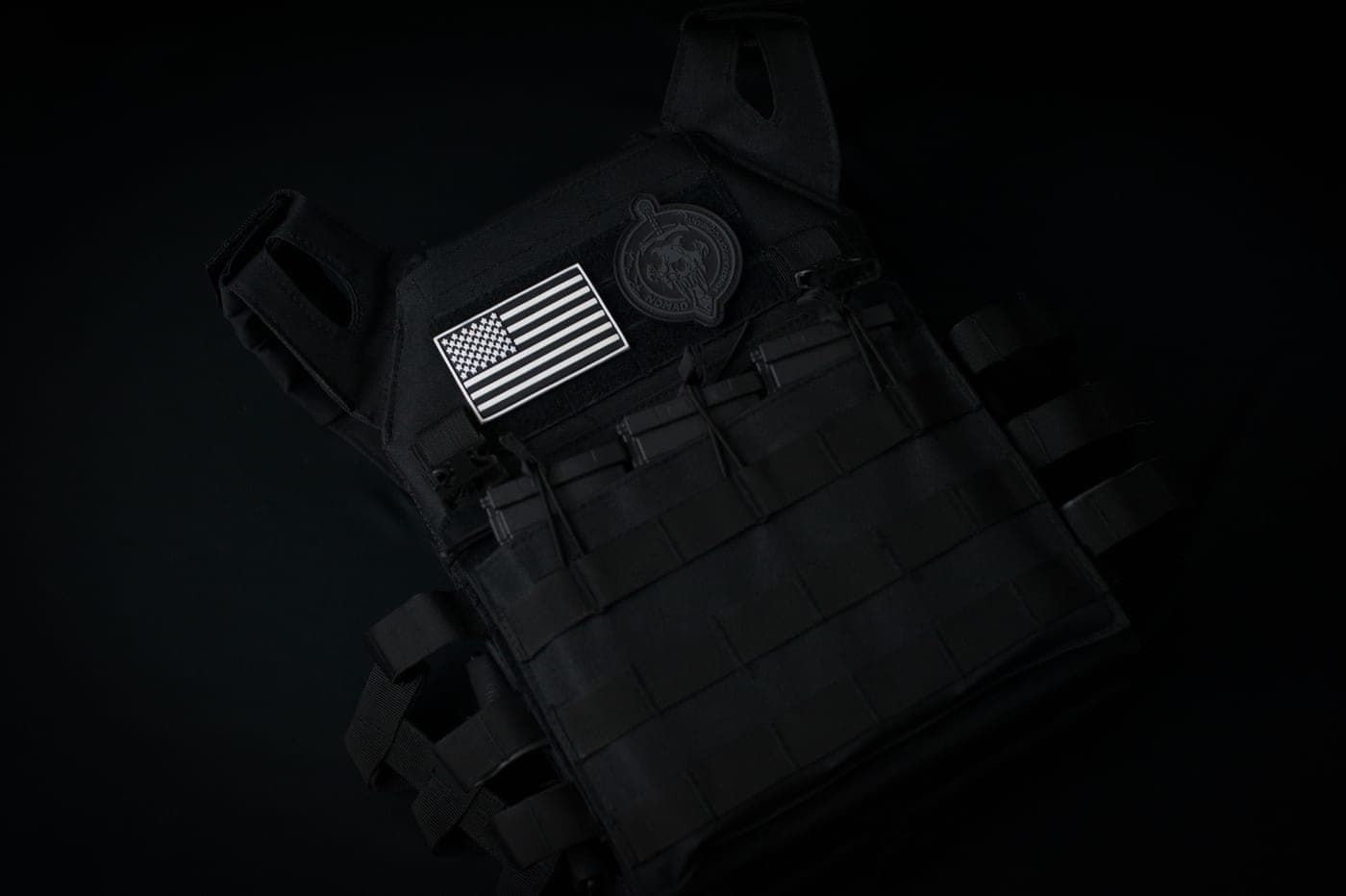 Assorted gear laid out on a dark tabletop