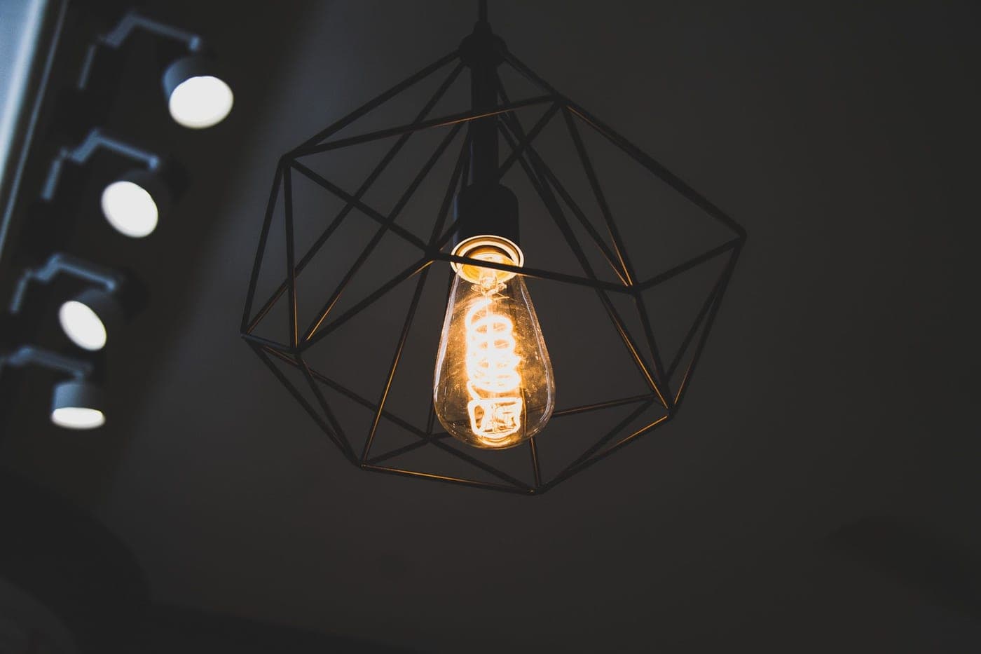 A bright lamp glowing against a dark background